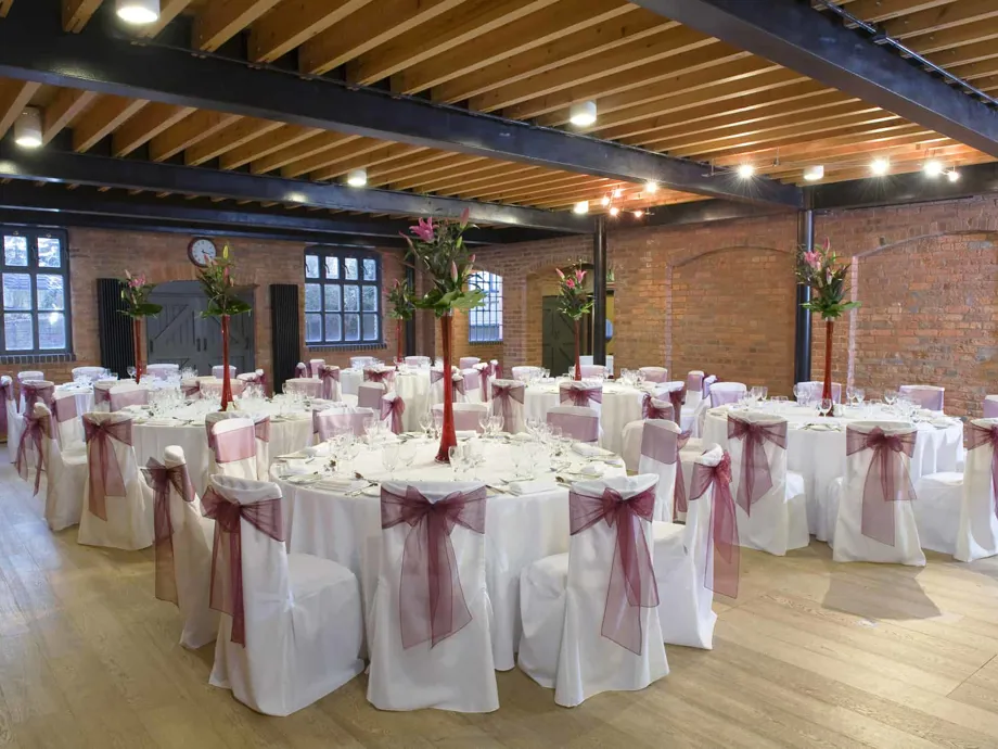 Image of the Waterside Room set up for a wedding reception with doors closed