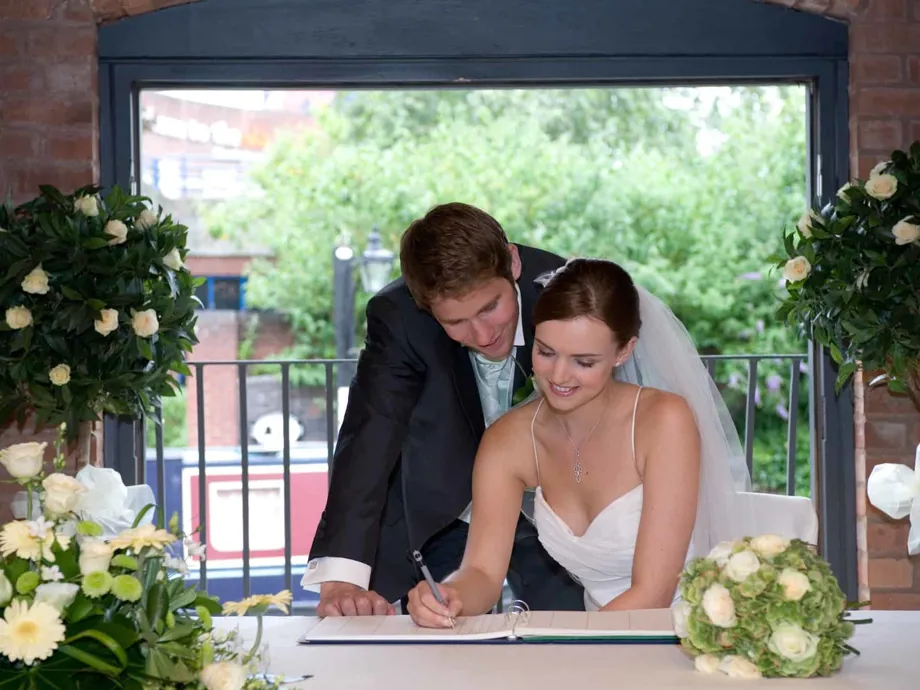 Signing the register in the Waterside Room