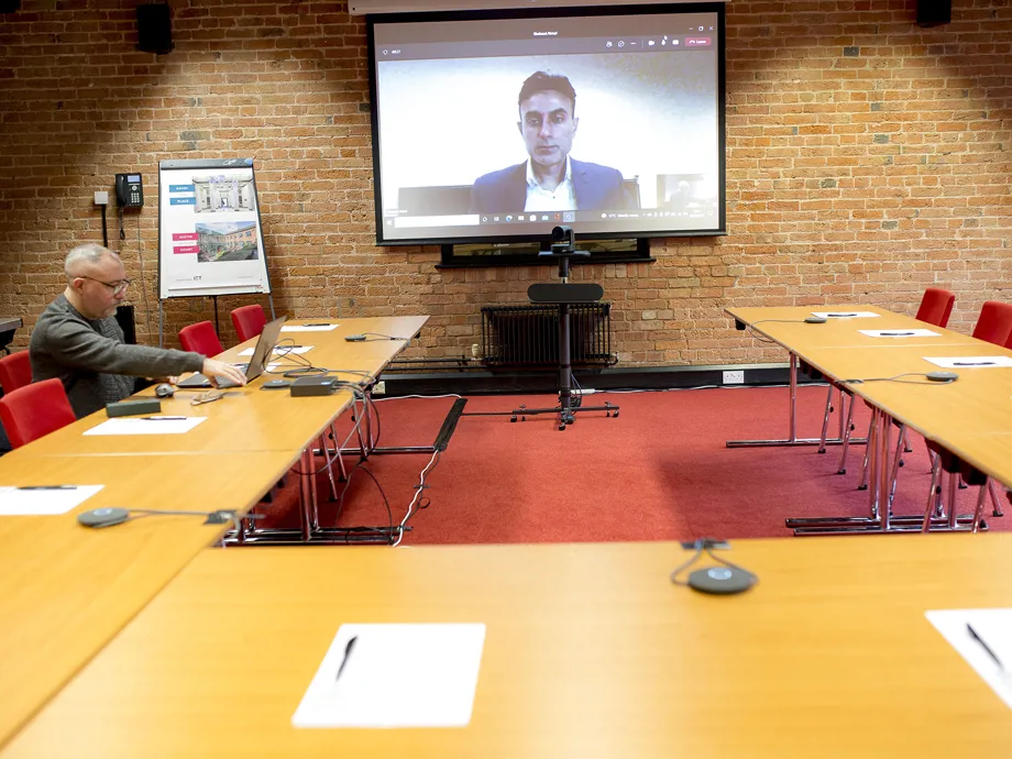 Person using video conferencing in Telford Room